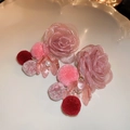 Detailed view of pink mesh rose earrings with dangling plush pom-poms on ceramic tray - Pink Mesh Rose Fur Ball Tassel Style / Gold-Pink Mesh Flower (Silver Needle)