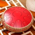 Red steel tongue drum with number scales and woven rope edge on a wooden background - 13 Inch 15 Notes - Cinnabar Red - Maple Leaf