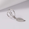 Detail of silver stainless steel double ear cuff with leaf pendant on a light background - Leaf Pendant Ear Cuff