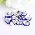 Macro detail of silver spacer beads with sparkling dark blue rhinestones for DIY jewelry - Silver Plated Royal Blue