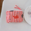 Detail of fabric cat coin purse with pink stripes and simple wish label on white desk - Red Stripe Cat
