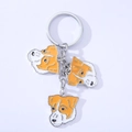Detailed view of three Jack Russell Terrier charms on a silver enamel keychain - Jack Russell Terrier