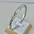 Bamboo style silver finish stainless steel bangle with sparkling crystal pave accents - Bamboo Design Silver Bangle
