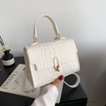 White faux leather crossbody bag with crocodile pattern and golden oval twist lock - White