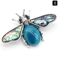 Bee brooch with large blue agate cabochon and colorful abalone shell wings - Blue Agate