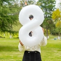 White 32-inch foil balloon number 8 being held outdoors for birthday party events - Number 8 / White