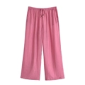 Close-up of pink wide-leg trousers featuring a drawstring waist and pleated texture fabric - XS / Pink Pants