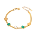 Bracelet chaîne serpent dorée avec trèfles en malachite verte et nacre blanche - Bracelet Fleur à Cinq Pétales