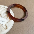 Macro view of contrast resin and dark wood拼接 round bangle on a ceramic tray - Brown Splicing (8# Wood Resin Splicing Bangle)