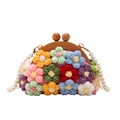 Floral crochet shell bag with colorful knit flowers, wooden handle, and pearl strap - Pink