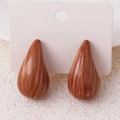 Waterdrop earrings in marbled brown finish displayed on a white jewelry card holder - Brown