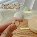 Pink ring-style nail dust brush with soft white bristles and adjustable finger band size - No. 17 (Ring Style Small Pink Brush)