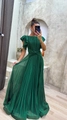 Detail view of deep green pleated evening dress featuring ruffle sleeves and waist twist design - S / Green