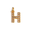 Macro view of gold H letter pendant with sparkling crystals on white background - Letter H / Gold