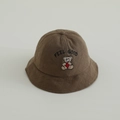 Detail view of the feel good bear embroidery on the brown quilted cotton bucket hat - 48-50cm (1-2 Years) / Coffee