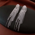 Detail of silver long tassel earrings with metallic bead chains on dark background - Silver Bead Chain Waterfall Droop Tassel Style