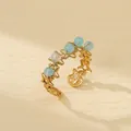 Detail view of gold star ring with light blue beads featuring 2.1cm inner diameter - Star Hollow Style