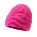 Winter knitted beanie cap in bright magenta pink with vertical ribbed texture - Rose Red