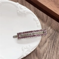 Macro detail of a silver hair clip with purple rhinestones on a vintage relief plate - Rectangle / Purple