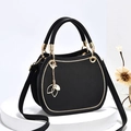 Elegante bolso de mano redondo negro con colgante de hoja dorada y correa ajustable - Negro
