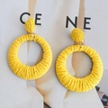 Bright yellow raffia woven hoop earrings in bohemian geometric circular drop style - Yellow Round Woven Vacation Style Earrings