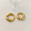 Detail view of thick gold C-shape hoop earrings with mirror-like polished surface - Minimalist Hoop Ear Clip (R514-139) / Gold