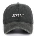 Detail shot of white ESKETIT embroidery on a dark grey washed cotton baseball cap - Army Green