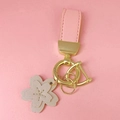 Pink leather strap keychain with beige cherry blossom floral charm and gold metal ring - Pink Leather [Cherry Blossom]