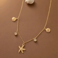 Golden starfish and seashell necklace with round crystals on warm brown background - Starfish Seashell Rhinestone Necklace (H1304)