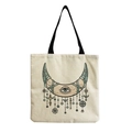 Detail of minimalist cream tote bag showing fabric texture and mystical eye pattern - Bohemian Moon and Eye (hm2709)