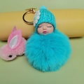Cute sleeping baby doll keychain with plush ball in blue knitted hat and gold ring - Lake Blue