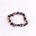 Detailed macro view of colorful natural stone chips on an elastic handmade bracelet - Tourmaline