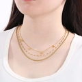 Detail of layered gold twisted chain necklace with MAMA letter charms and white beads - Style A Gold Three-layer Stacked