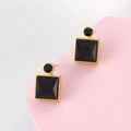 Macro detail of geometric square black gemstone earrings with gold-plated metal frames - Black