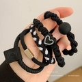Kids black elastic hair ties set with heart charms and smiley face leather accents - Black