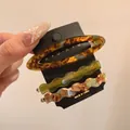 Three-piece acetic acid hair clip set featuring amber oval and wavy marble patterns - Blue-green Set