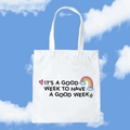 White canvas tote bag with 'It's a good week' slogan and colorful rainbow icons - It's A Good Week To Have A Good Week / Rainbow Star