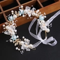 Detailed macro view of bridal flower headband with white pearls and gold metal leaves - Pearl Flower Headband - Blue