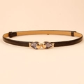 Slim black leather belt for dresses with gold interlocking fish buckle and gray crystals - Fish Shape Buckle (19245) / Black