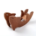 Dolphin shaped wooden pot mat in dark brown wood grain finish for heat insulation - Ebony Dolphin Shape Single Base