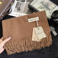 Close-up of brown cashmere-feel scarf with long tassels and elegant brand tags - 200x68cm / Dark Mocha