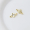 Macro shot of gold heart wing charms with zircons for DIY jewelry making - Style 16