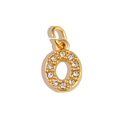 Macro shot of gold-plated letter O pendant with sparkling cubic zirconia inlay detail - Letter O / Gold