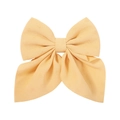 Macro detail of yellow floral chiffon fabric on a large bow hair clip with jacquard texture - Yellow