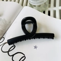 Matte black oversized shark hair claw clip with cross-wrap design on white book background - Matte Black - Butterfly Buckle Straight (Approx 11.3cm)