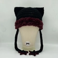 Hand-knitted cat ear hat with red faux fur trim, star charms, and long tassels - Black