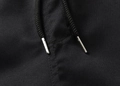 Macro shot of the drawstring details on these black loose athletic shorts for men - XS / Black (Detail 2)