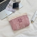 Close-up of pink velvet makeup bag with heart pattern and shine like the stars embroidery - Heart Jacquard Style / Velvet Heart Nude Pink