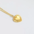 Gouden hartvormige hanger met zonnestraal patroon en minimalistische gouden ketting - Hart