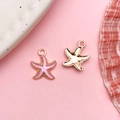 Pink enamel and gold starfish charms for DIY ocean-themed jewelry making - Pink Enamel Ocean Starfish